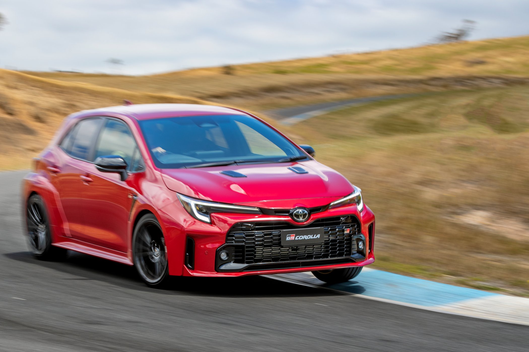 2023 Toyota GR Corolla GTS (Feverish Red) driving on race track