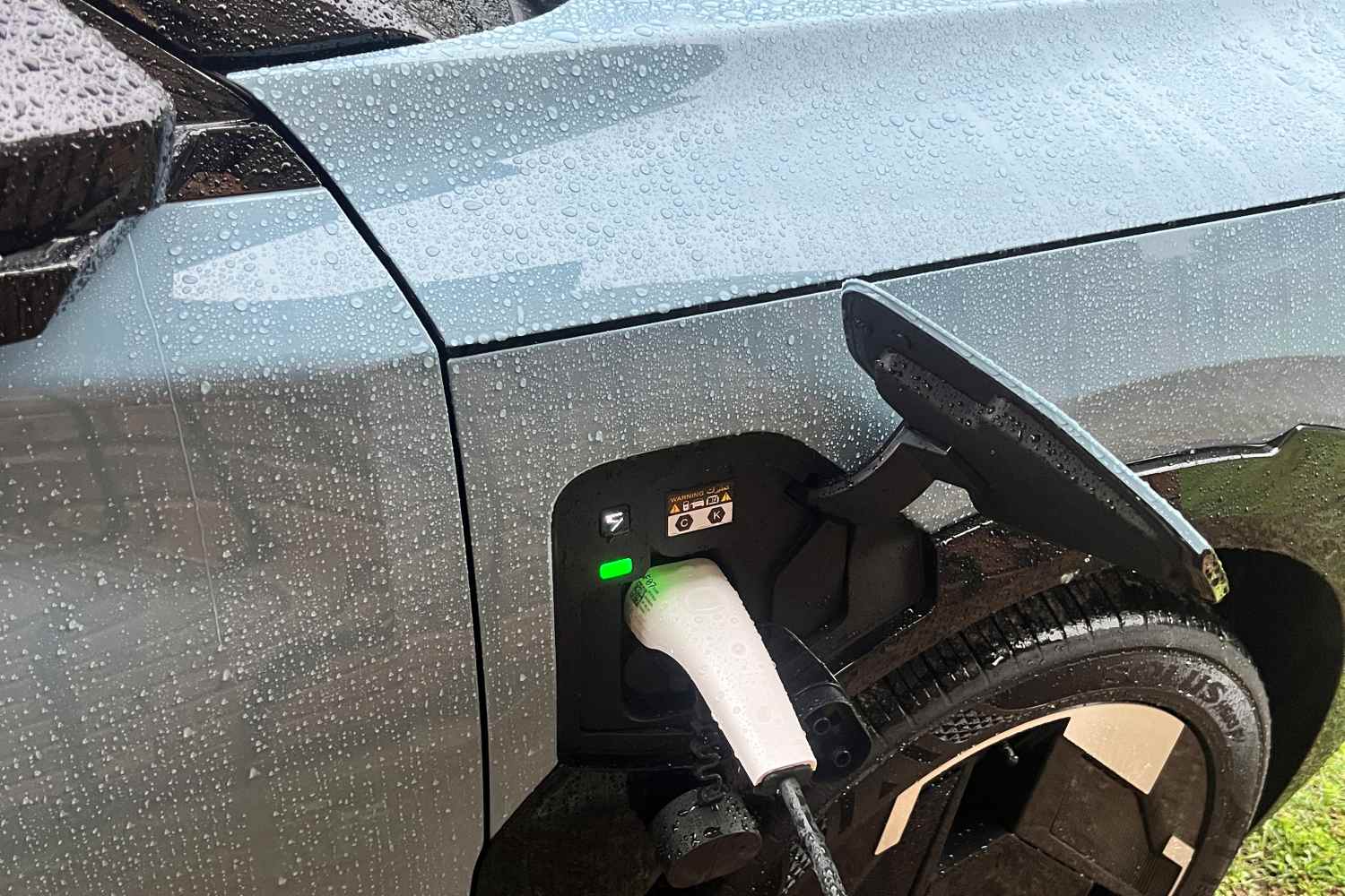 charging an EV in the rain