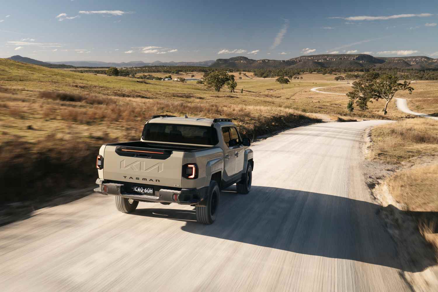 KIA - TASMAN_TAN_X-Pro dirt road driving 1