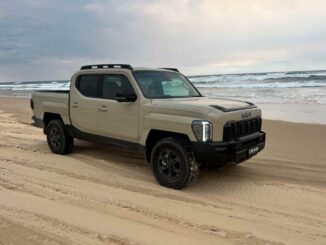 Kia Tasman X-Pro 4WD Ute front quarter on beach 1
