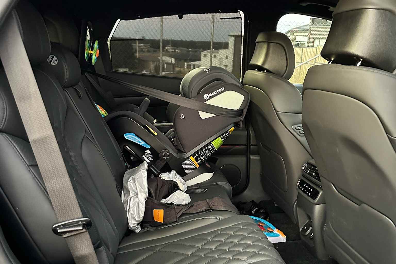 2026 Genesis GV80 Coupe Black interior rear seats with baby seat 1