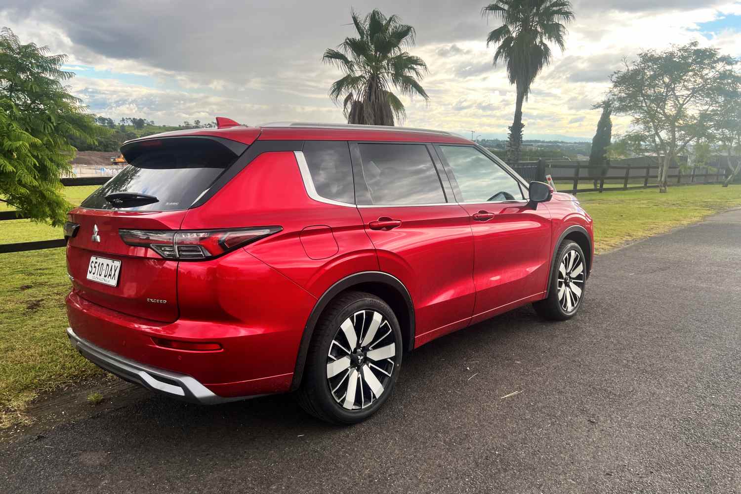 2026 Mitsubishi Outlander Exceed five seat SUV rear quarter 1