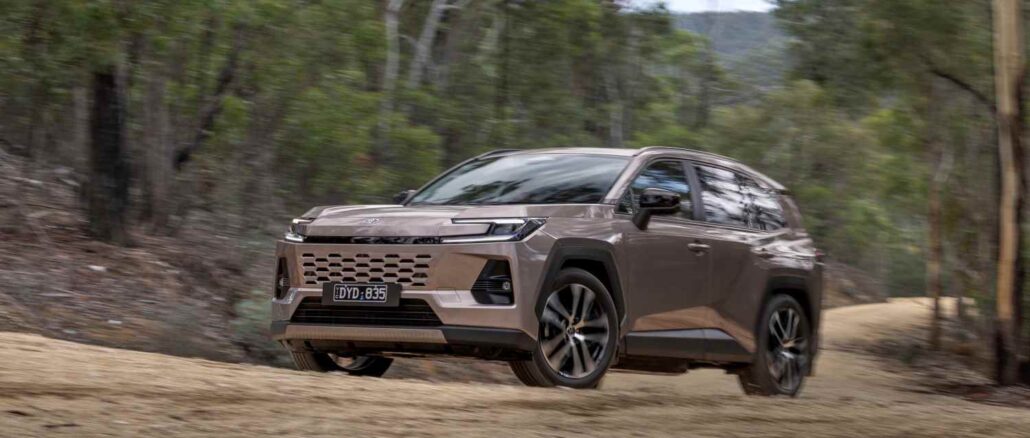2026 Toyota RAV4 Cruiser AWD Hybrid front driving on dirt road 2