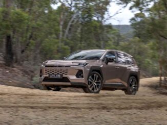 2026 Toyota RAV4 Cruiser AWD Hybrid front driving on dirt road 2