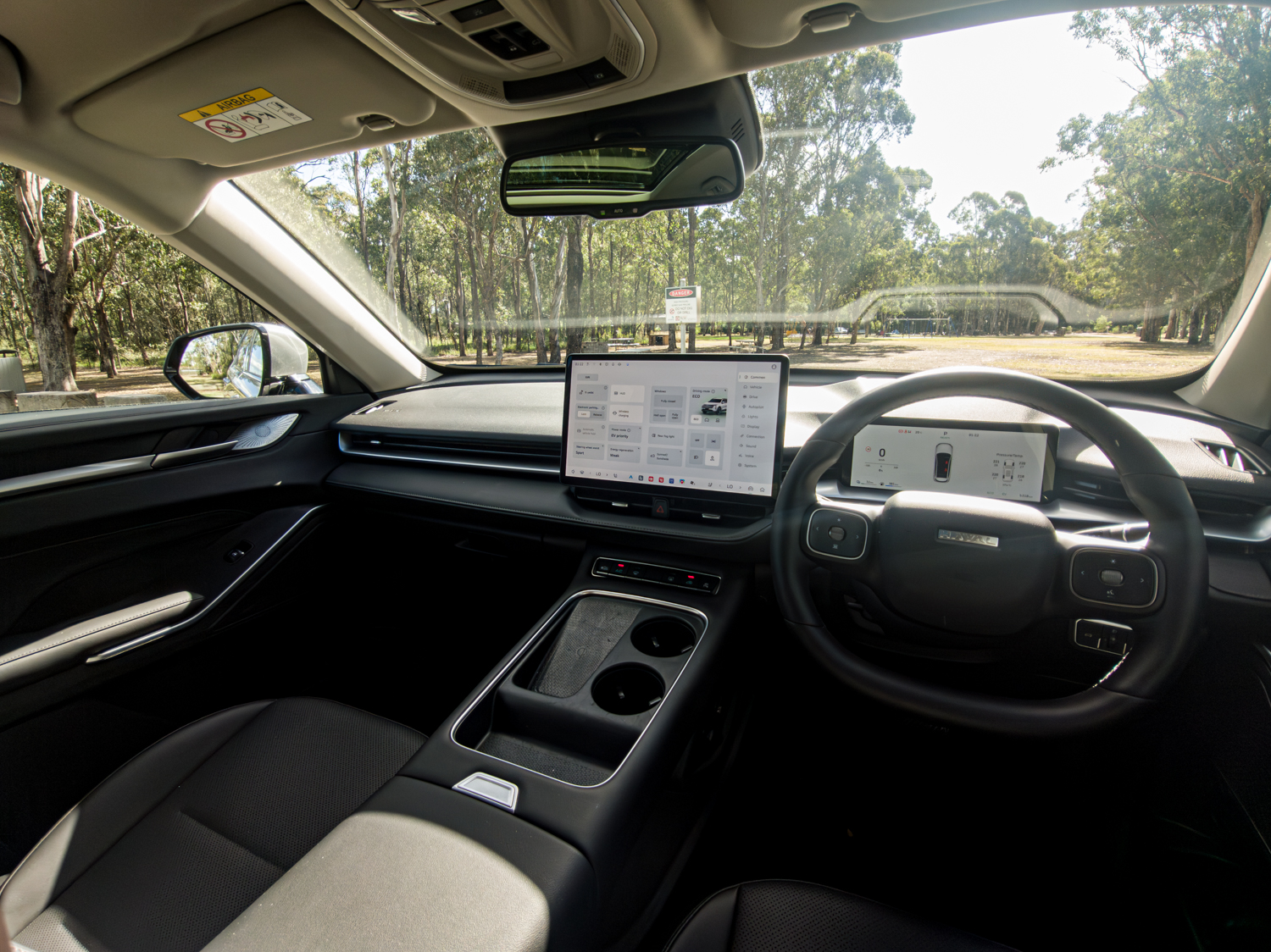 2026 Haval H6 dashboard overview from driver's position showing minimalist instrument panel and floating touchscreen