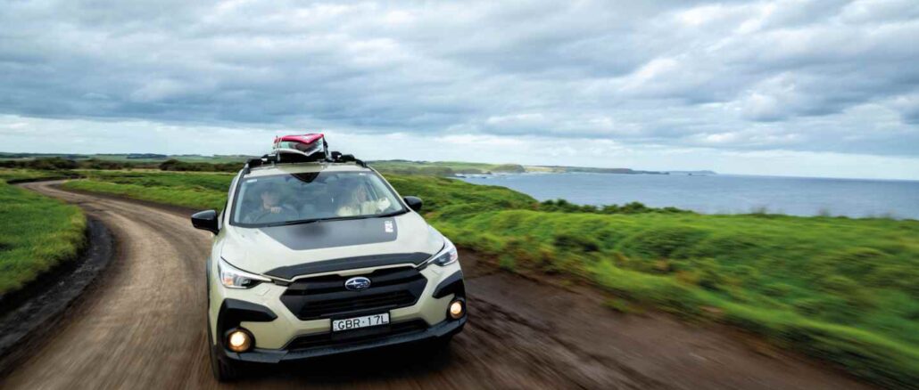 MY26 Crosstrek AWD Rip Curl SE Driving Front Coast_batch